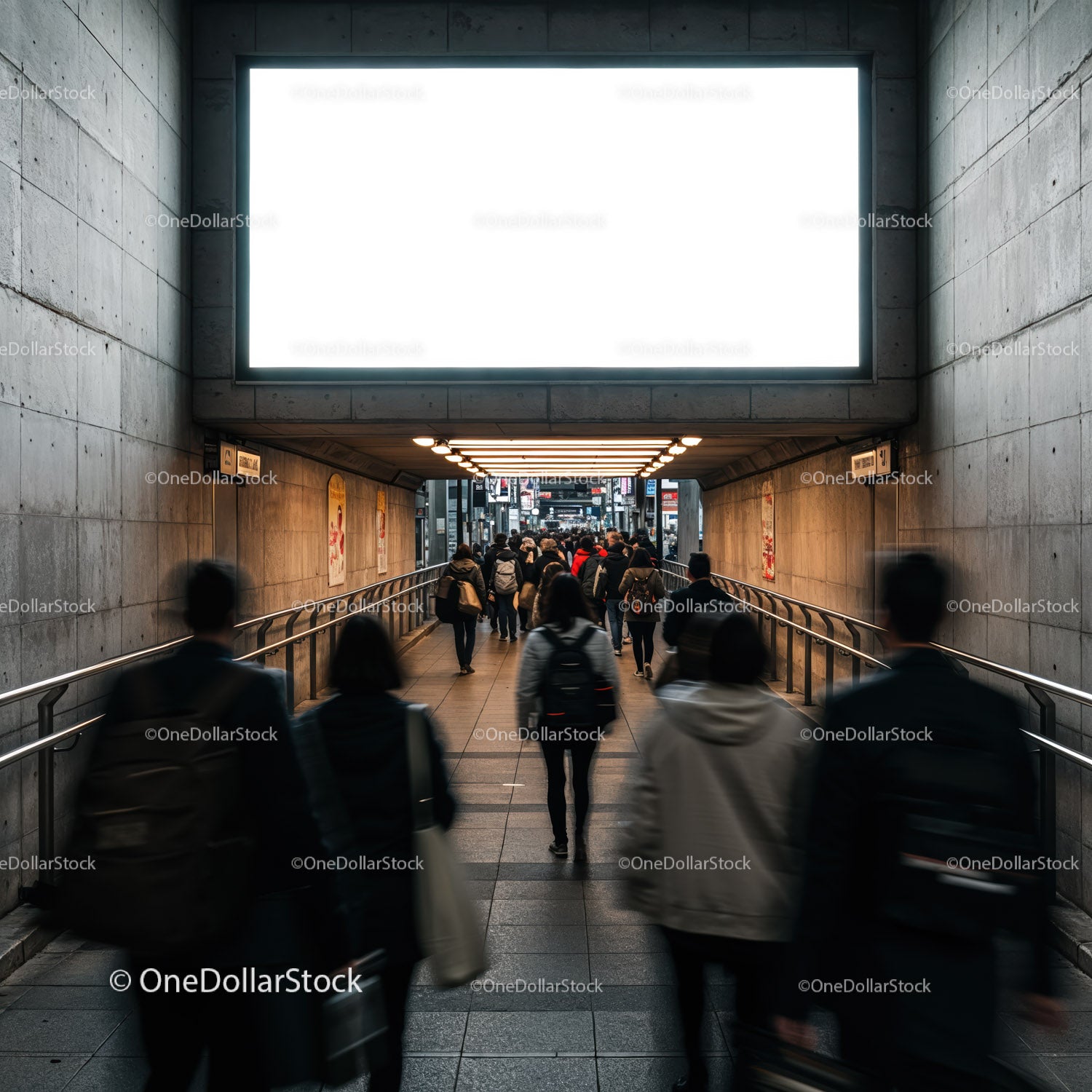 Crowd walking through urban underpass in soft light