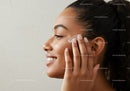 Smiling Woman Wiping Her Face in Close-Up Portrait