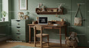 Kids' Study Area with Wooden Desk and Plush Toys on Green Wall