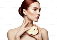 Elegant Woman with Red Hair Holding Sliced Pear Portrait Stock Photo