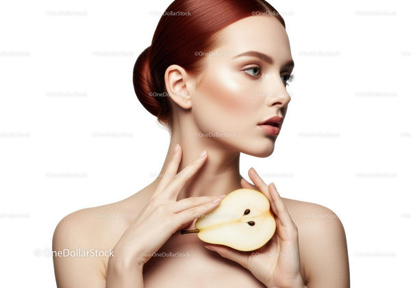 Elegant Woman with Red Hair Holding Sliced Pear Portrait Stock Photo