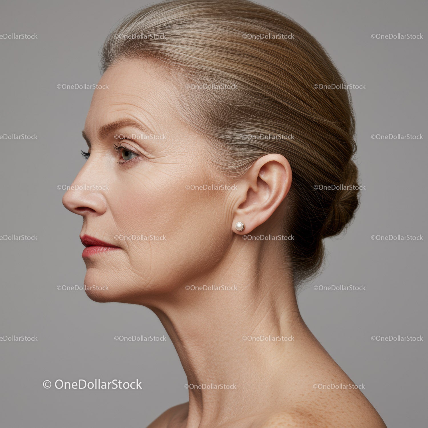 Elegant Elderly Woman in Side Profile with Pearl Earring for Makeup