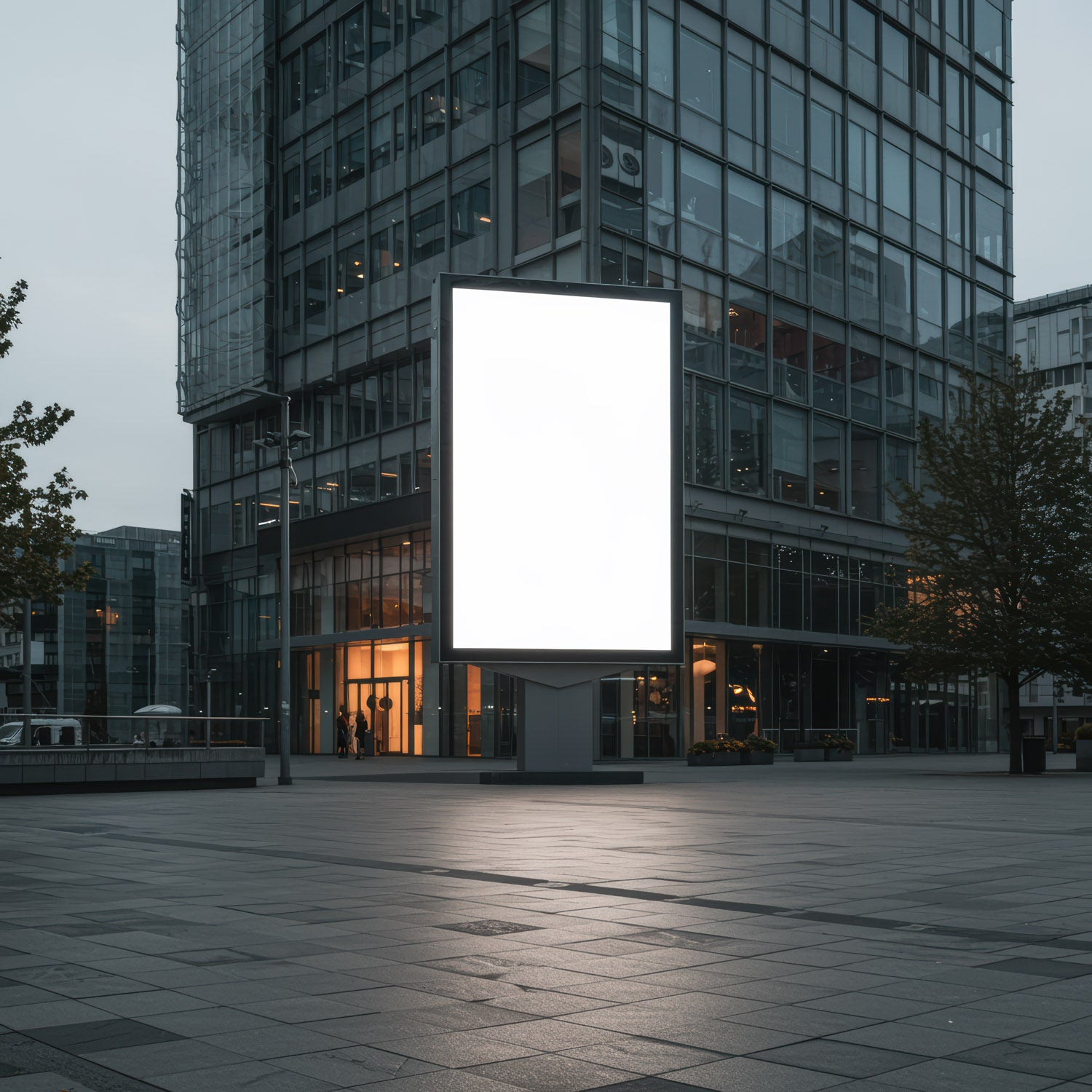 Empty Digital Billboard in Modern Urban Plaza at Dusk