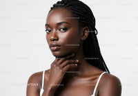 Elegant African Woman Portrait with Braided Hair and Flawless Skin
