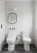 Minimalist White Bathroom with Wall Mirror and Modern Toilet