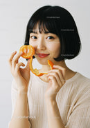 Portrait of a Smiling Woman Holding Fresh Orange and Peel