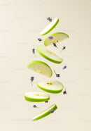 Floating slices of green apple with delicate lavender buds