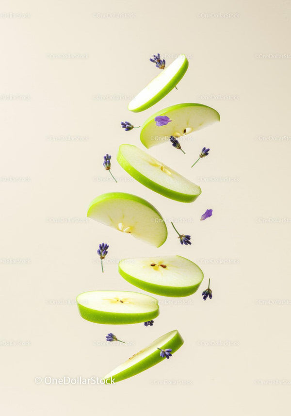 Floating slices of green apple with delicate lavender buds