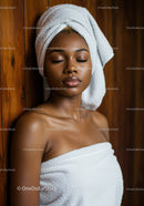 Relaxing African American Woman in Spa with Towel Wrap and peaceful expression