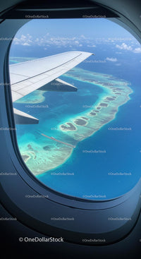 Aerial View of Tropical Islands and Turquoise Ocean from Airplane Window