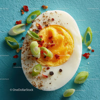 Close-up of Half Boiled Egg with Green Onions and Red Chili Flakes