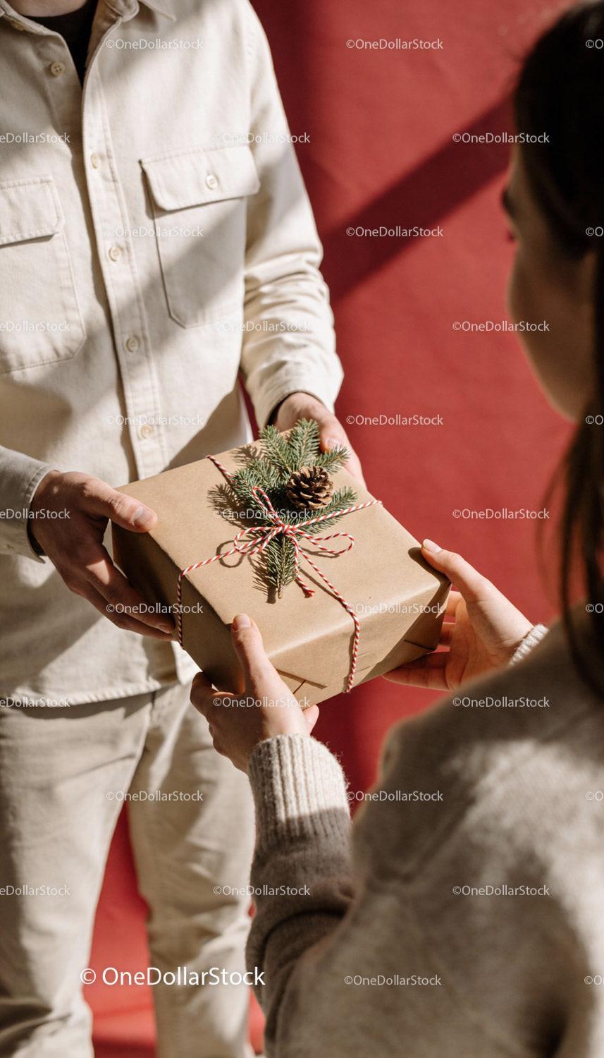 Warm holiday gift exchange with rustic Christmas wrapping