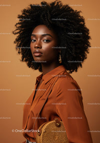Elegant African American Woman in Warm Studio Setting with Curly Hair