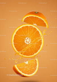 Fresh orange slices splashing with juice on orange background