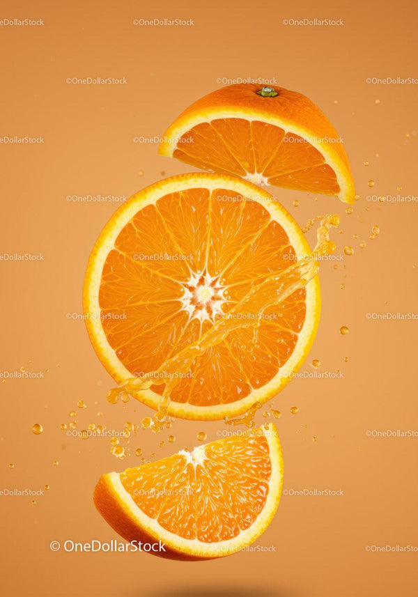 Fresh orange slices splashing with juice on orange background