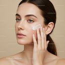 Close-Up of Woman Applying Skincare Cream on Face for Healthy Skin
