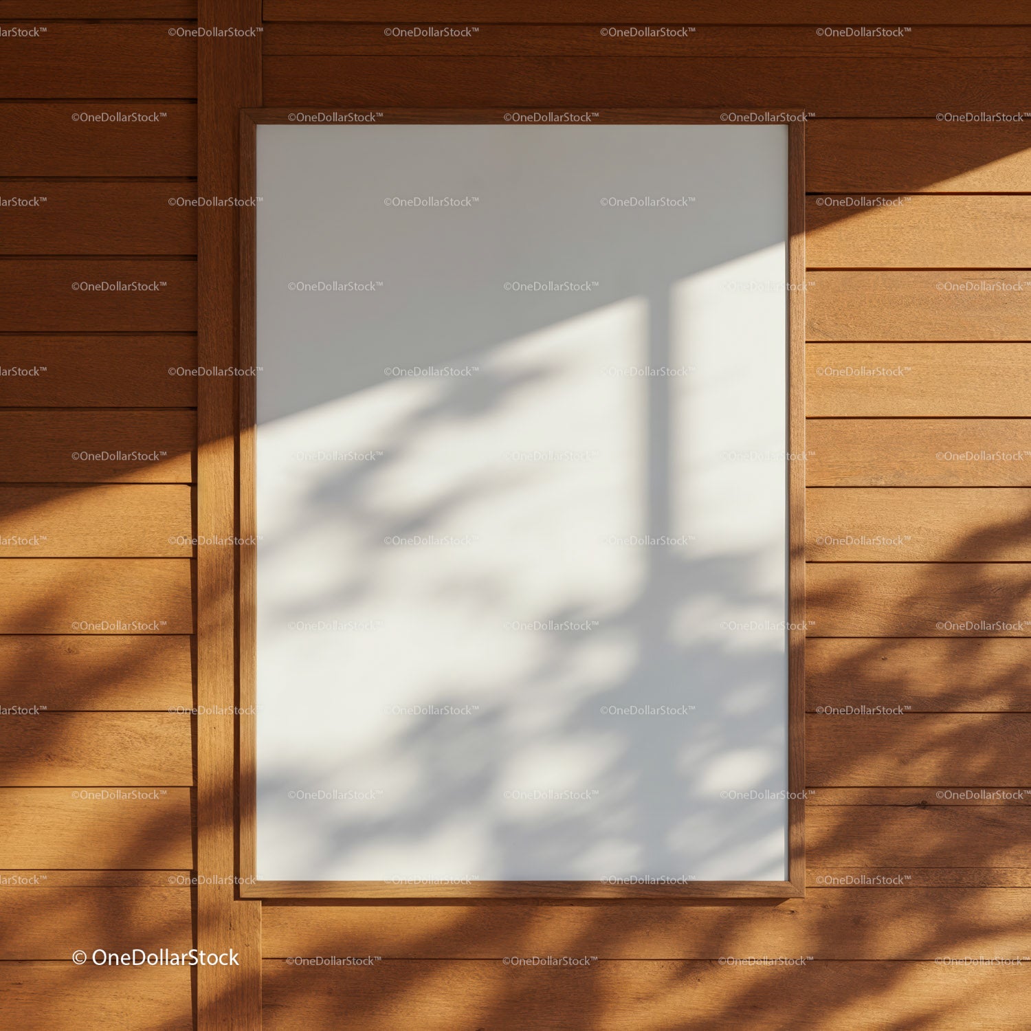 Blank white poster frame on wooden wall with shadows