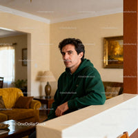 Man in Green Hoodie Relaxing in Cozy Living Room