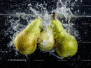 Fresh Green Pears Splashing into Water with Dynamic Motion