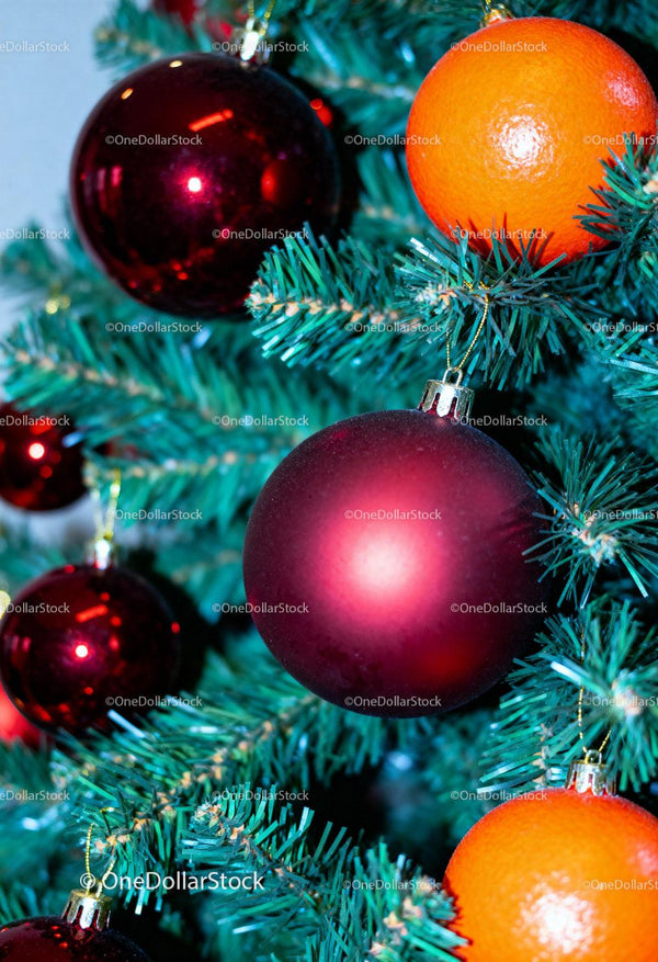 Red and Orange Ornaments Decorating a Christmas Tree