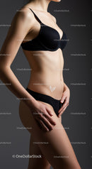 Elegant Woman in Black Lingerie with Smooth Skin and Artistic Lighting