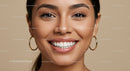 Close Up of Smiling Woman with Natural Makeup and Hoop Earrings