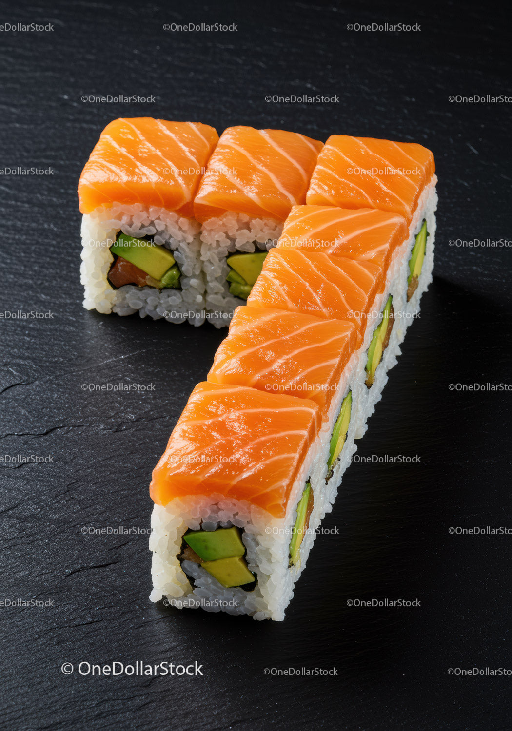 Fresh salmon sushi rolls arranged in number seven shape