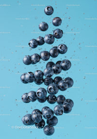Fresh Blueberries Immersed in Clear Water Splash