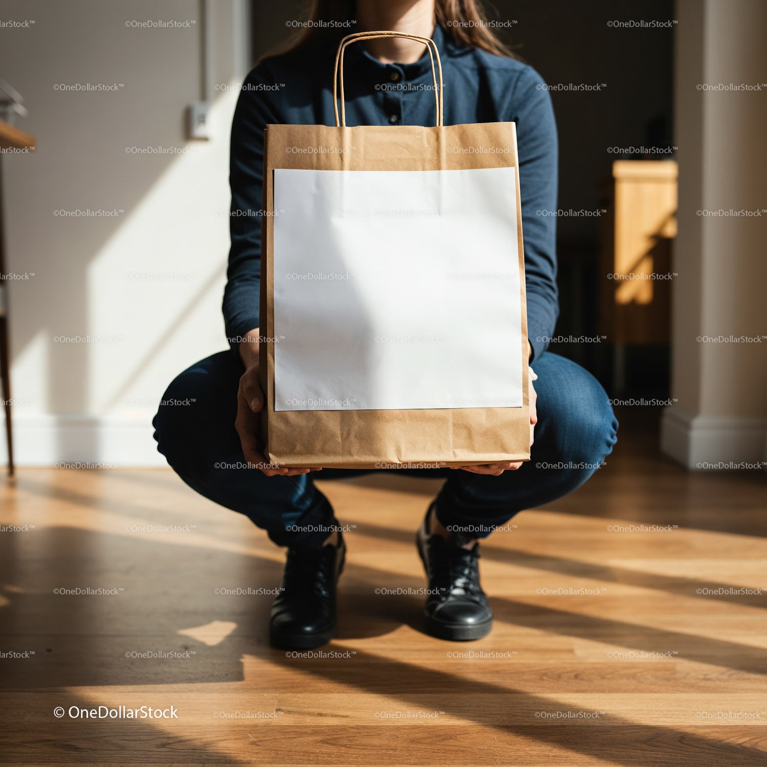 Person Holding Brown Paper Bag with Blank Label Indoors
