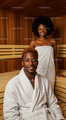 African American Woman Relaxing in Sauna Spa with Towel and Smile
