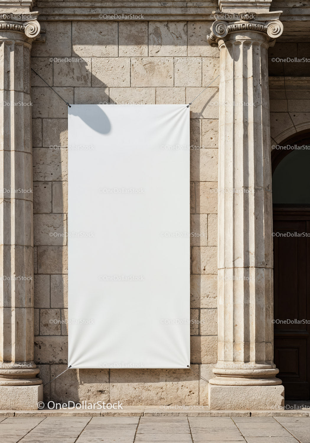 Blank vertical banner hanging on historic stone building