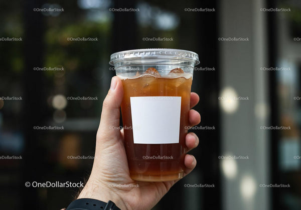 Hand Holding Iced Coffee in Clear Plastic Cup JPG Mockup Image