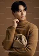 Elegant Asian Model Wearing Beige Turtleneck and Carrying Metal Clasp Bag