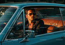 Stylish Man in Sunglasses Sitting in Classic Vintage Car at Sunset