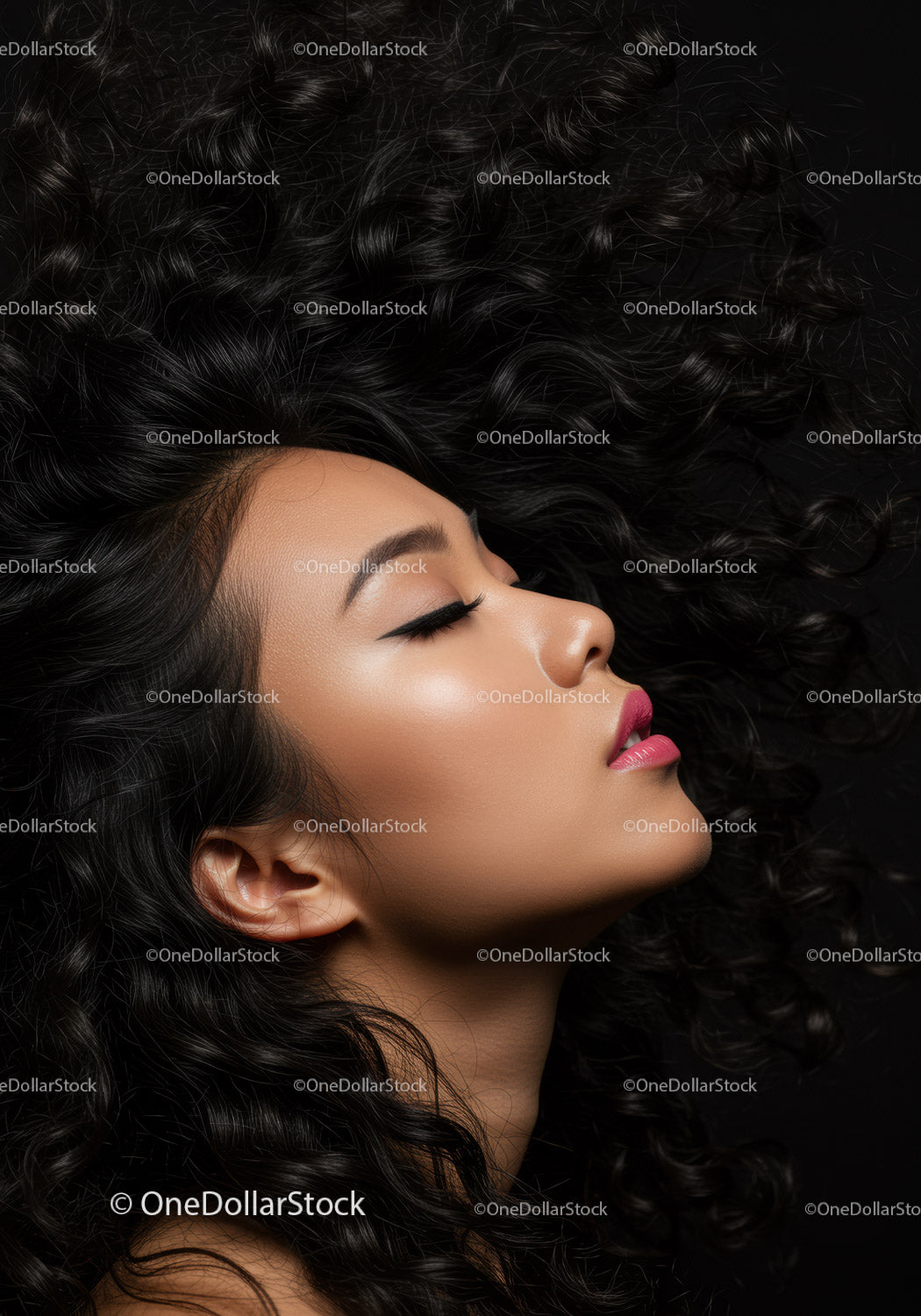 Elegant woman with curly hair in serene profile pose