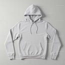 Minimalist White Hoodie Laid Flat on Gray Surface