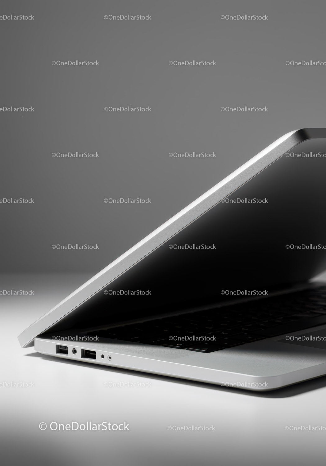 Close-up of a Silver Laptop with USB Ports on Modern Desk