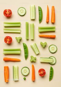 Fresh sliced vegetables arranged on beige background
