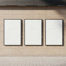 Three Blank Vertical Posters on Beige Stone Wall
