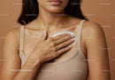 Close-up of Woman Applying Lotion to Chest in Skincare Routine