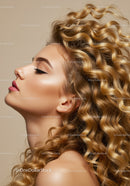 Profile of woman with voluminous golden curly hair