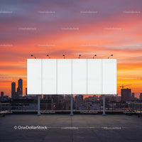 City Skyline with Construction Cranes and Sunset Sky