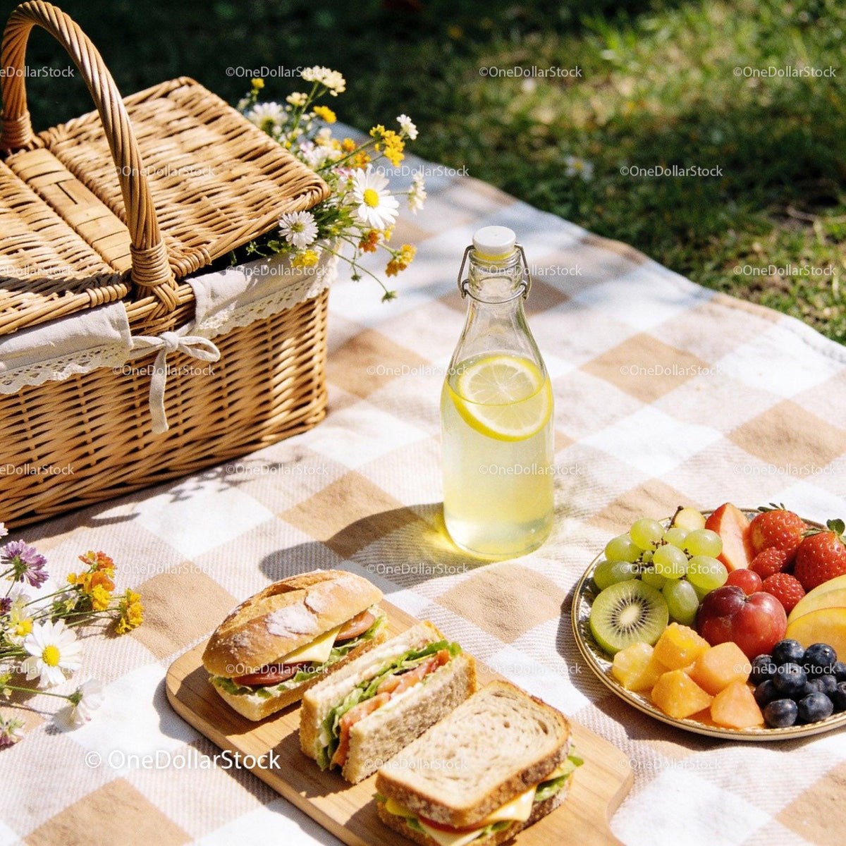 Fresh picnic spread with sandwiches and fruit platter