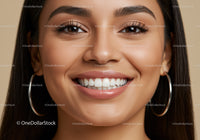 Close Up of Smiling Woman with Flawless Skin and Hoop Earrings
