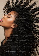 Profile of woman with voluminous natural curly hair