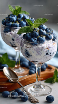 Berry Cheesecake in Glass Cup with Fresh Mint and Blueberries