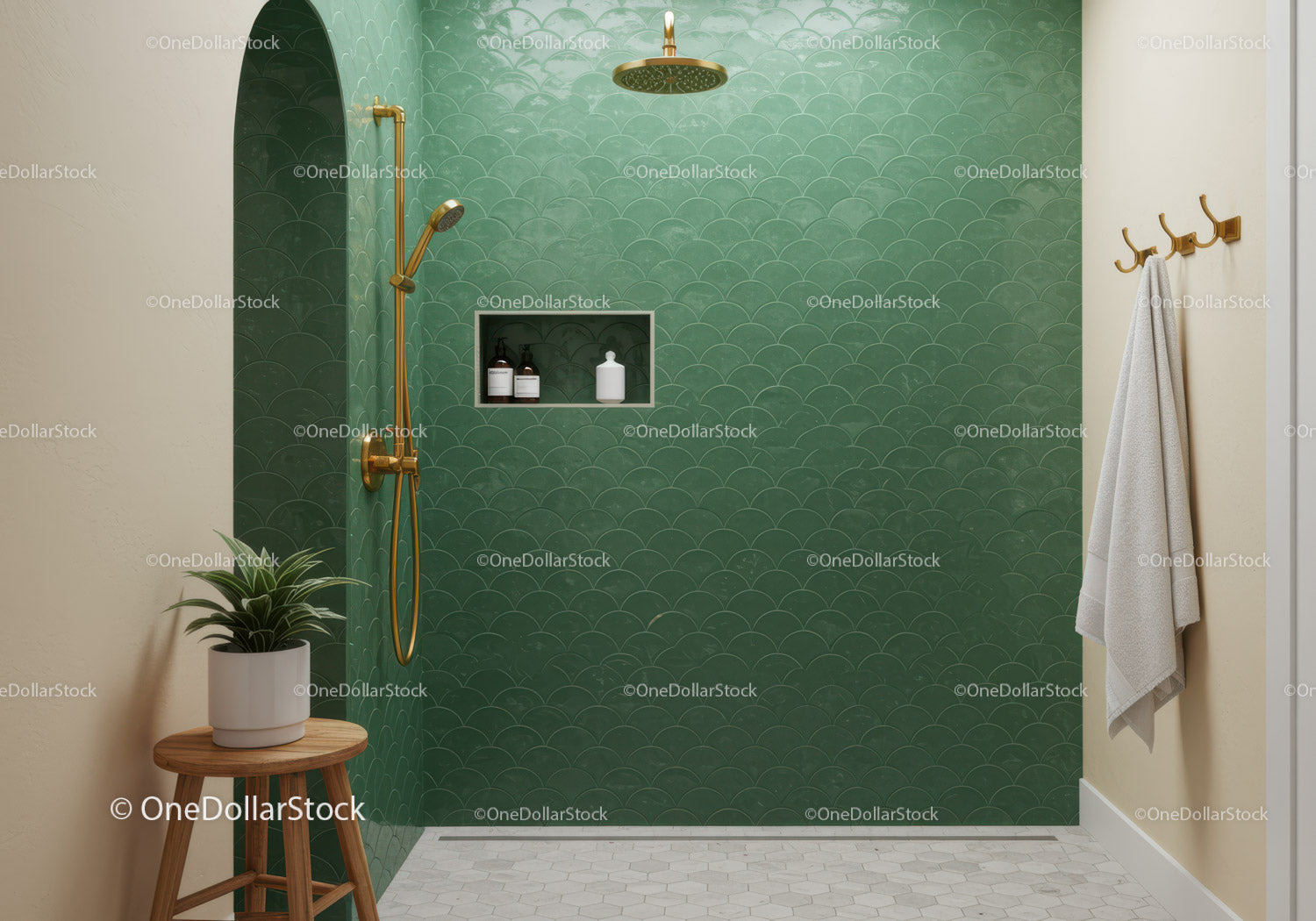 Modern walk in shower with green tiles and gold fixtures