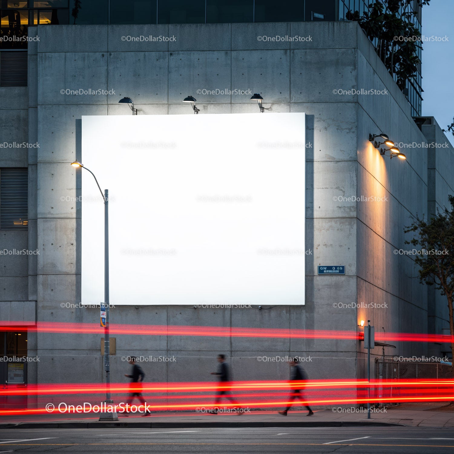 City street with illuminated blank billboard at dusk