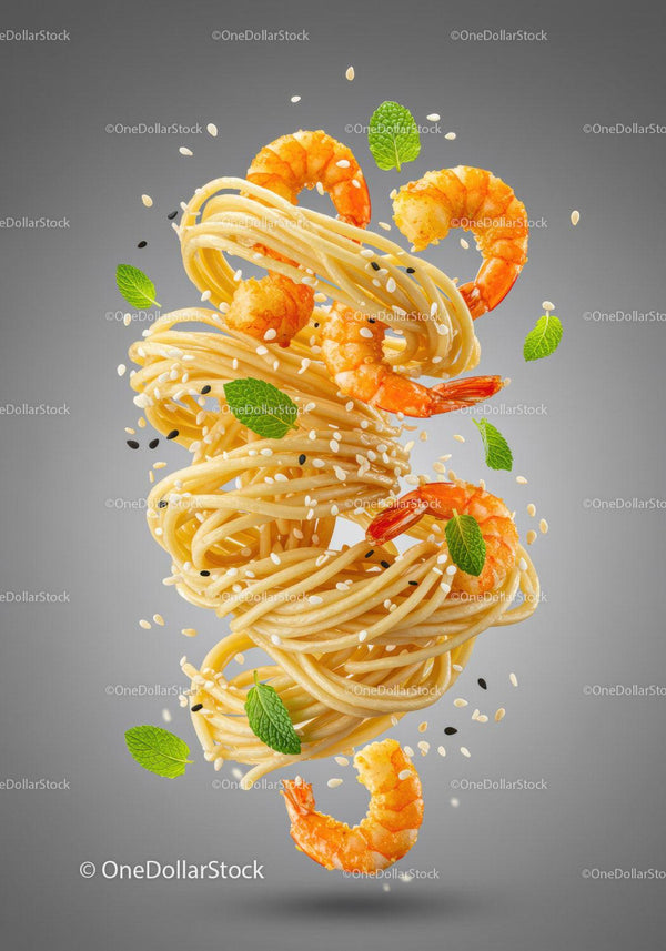 Floating spaghetti with shrimp and fresh mint leaves