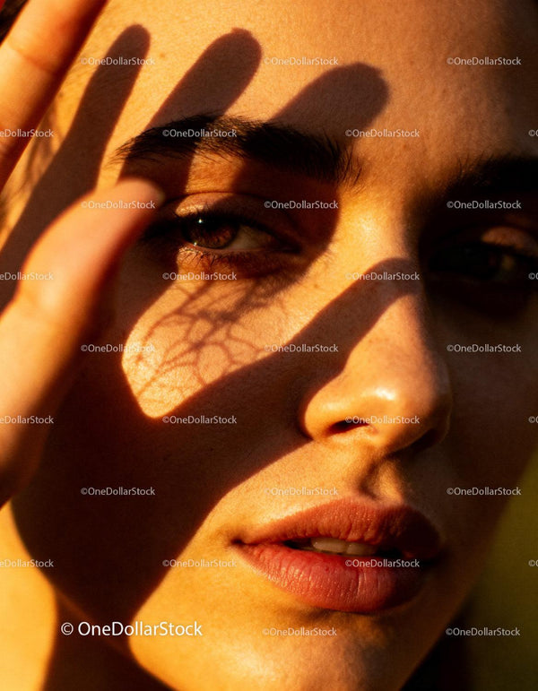 Close-up of a woman’s face with soft shadows